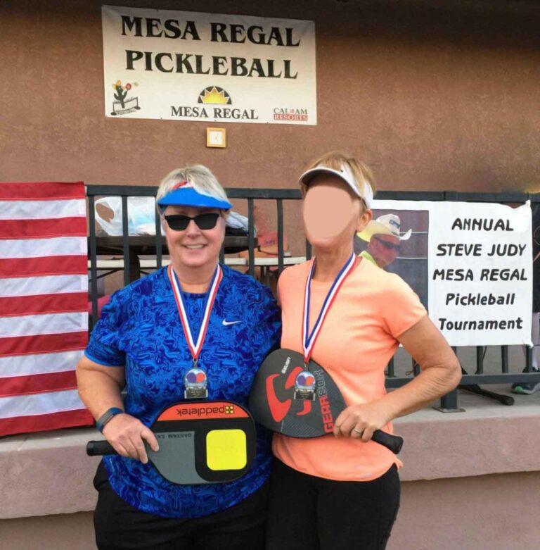 Female Pickleball Players getting a medal